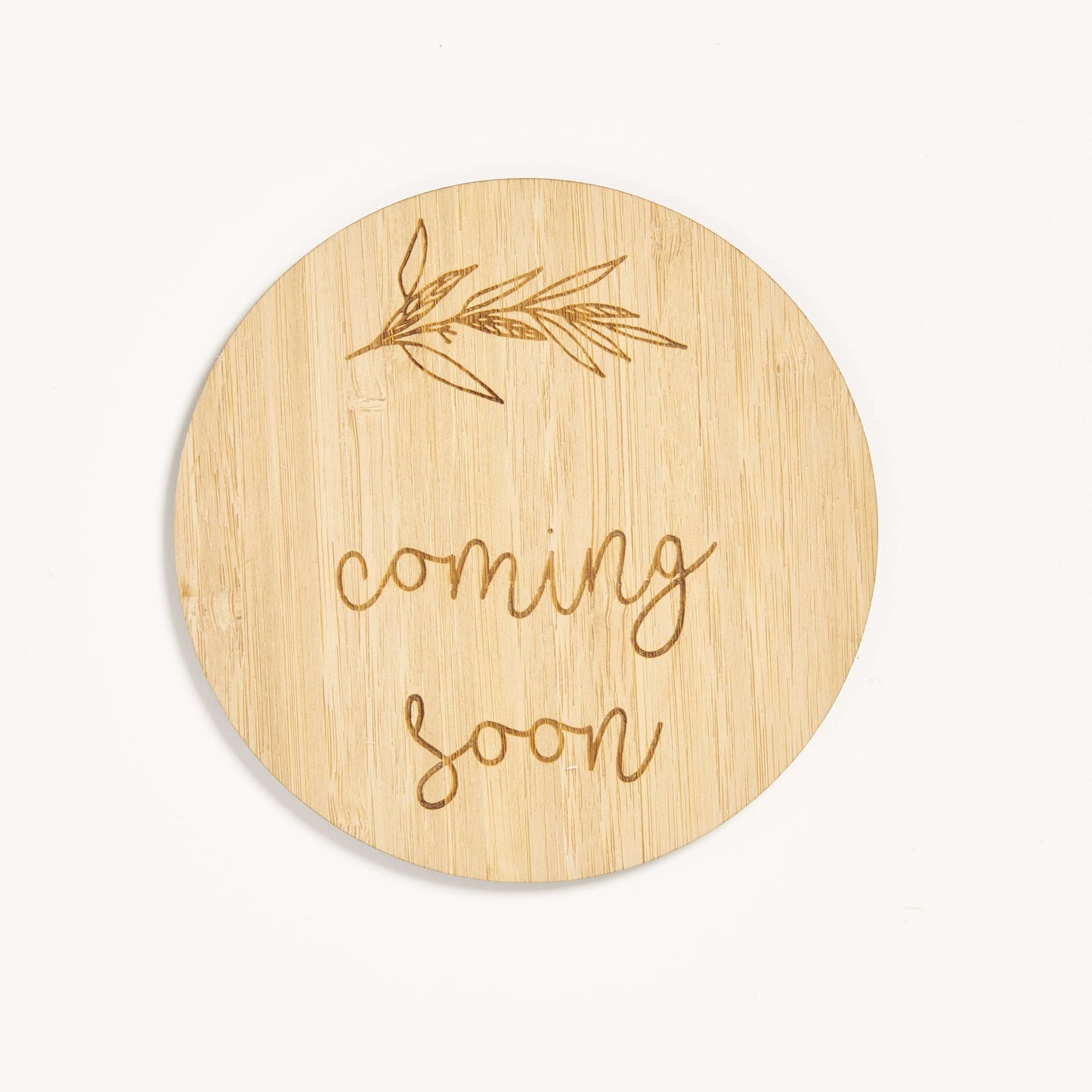 Image of our Coming Soon Token made of wither natural or carbonised bamboo.
