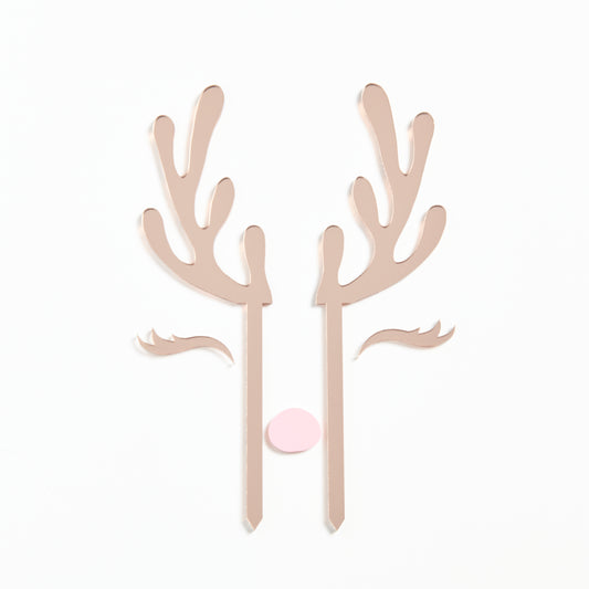 Product Photo of our Reindeer Cake Topper set in Rose Gold Mirror with a pastel pink nose.