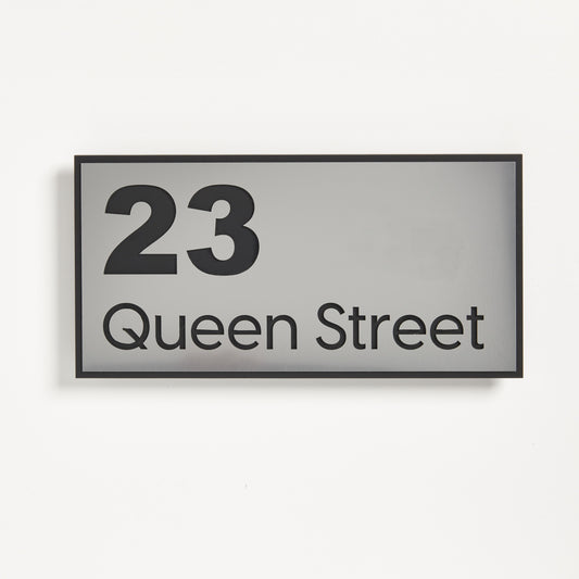 Our Kiwi Address sign made from 3mm black acrylic topped with a stainless steel look UV stable acrylic.  Address sign says 23 Queen Street.