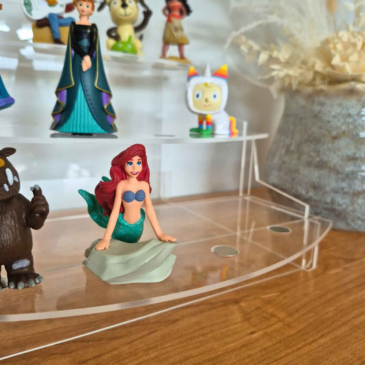 Mermaid  Tonie on a clear acrylic stand with other Tonies in the background