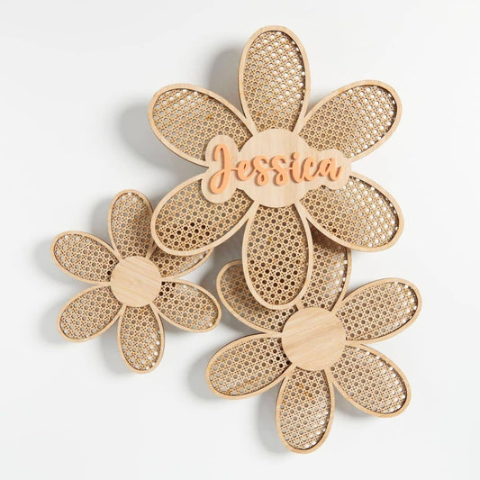 Three floral-shaped bamboo wall plaques with the name Jessica in orange acrylic.